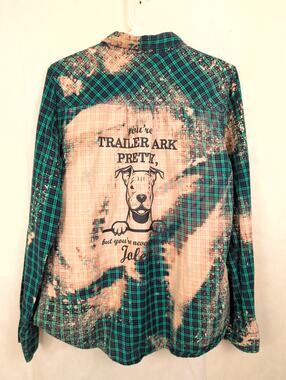 "You're trailer park pretty but you'll never be Jolene," plaid button up top Med